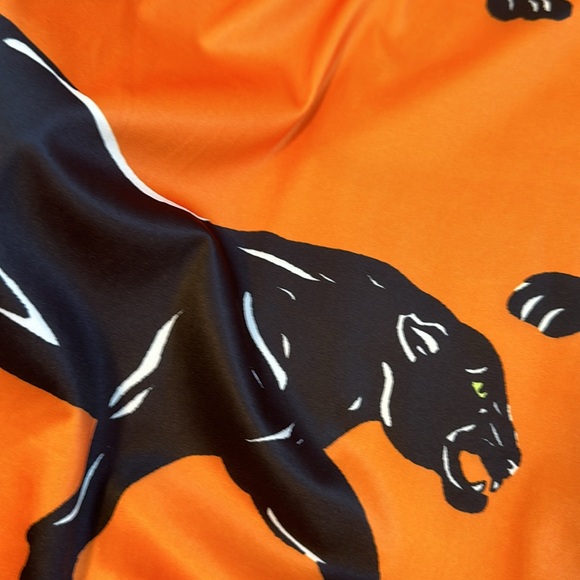 Orange and black printed dress with gold chain straps. Size medium - Picture 3 of 4